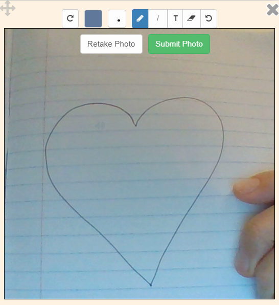 Draw activity with a heart sketched on lined paper.